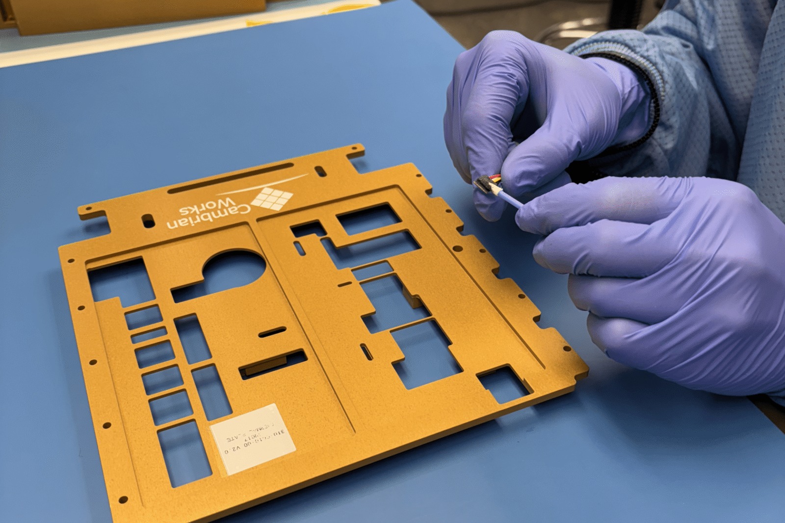 Cambrian Works flight hardware chassis under assembly.