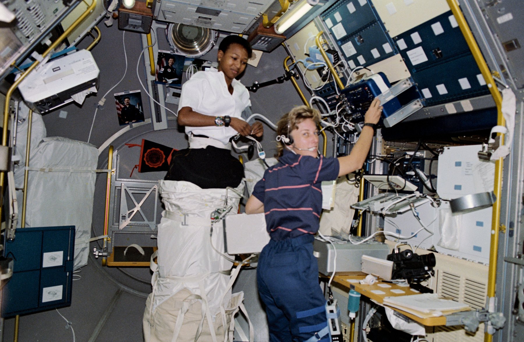 Mae Jemison setting up the lower body negative pressure experiment inside the Spacelab-J module